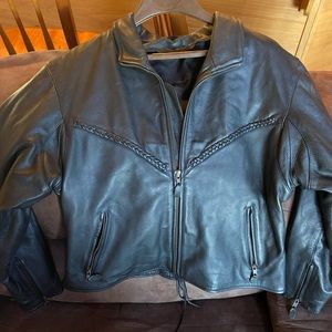 Lady’s black leather bikers jacket.